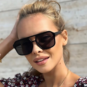 Classic double bridge aviator sunglasses with black square frames worn by a female model