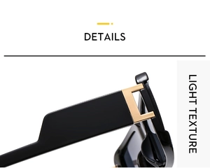 Close-up of golden metal hinge on black square sunglasses with light texture frame