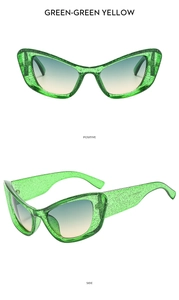 Front and side view of green glitter cat-eye sunglasses with yellow gradient lenses