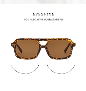 Detail of square double bridge sunglasses with tortoise shell frame and brown lenses
