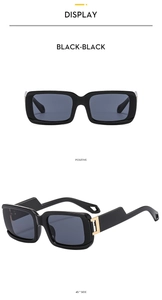 Detail view of black square sunglasses with unique stepped temples and gold metal hinges