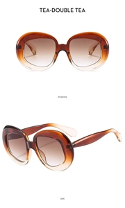 Positive and side view of oval vintage sunglasses with thick amber gradient frames