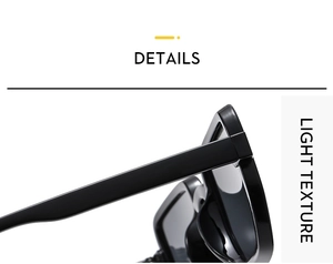 Detail shot of black retro sunglasses showing wide frame temples and light texture