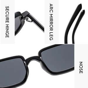 Detail view of secure hinge, arc mirror leg, and nose pads of black sunglasses