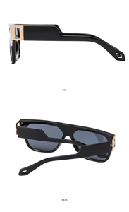Detail view of square black sunglasses showing gold hardware and side temple design
