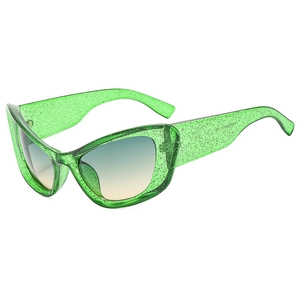Neon green cat eye sunglasses with silver glitter frame and blue gradient lenses