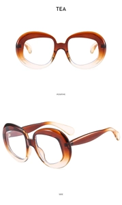 Front and side views of tea gradient oval retro eyewear frames with metallic hinges