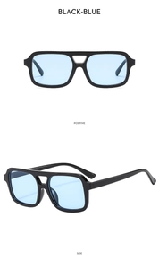 Detail view of square double bridge sunglasses with black frames and blue lenses