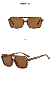 Detail view of retro square double-bridge sunglasses in demi-tea tortoiseshell finish