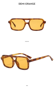 Detail view of square demi-orange sunglasses with double bridge and yellow lenses