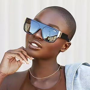 Fashionable black square oversized sunglasses with flat top design and gold temple accents