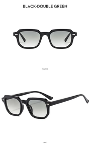 Detail view of square black sunglasses with double green lenses and silver rivets
