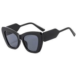 Fashionable oversized black cat eye sunglasses with thick wavy temples and dark lenses