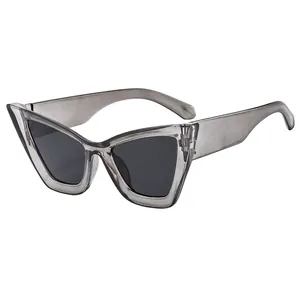 Eleganti occhiali da sole cat-eye con montura grigia trasparente e lenti anti-UV
