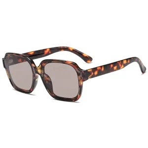 Fashionable oversized tortoiseshell polygon sunglasses with translucent brown lenses