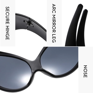 Detail of Y2K sunglasses featuring secure hinges, arc legs, and an integrated nose bridge