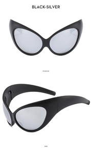 Close-up of black wide-frame cat-eye sunglasses with silver mirrored lenses in Y2K style