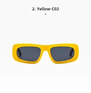 Detailed side view of bold yellow rectangular frames and wide temples on sunglasses