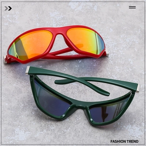 Flat lay of Y2K wraparound sunglasses in red and dark green with reflective lenses