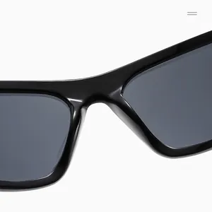 Macro detail of glossy black oversized frame hinges and nose bridge on Y2K sunglasses