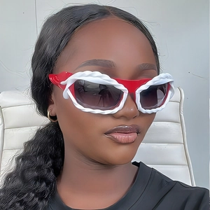 Y2K irregular sunglasses with red frames and white rope detail worn by a model