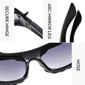 Detail of Y2K sunglasses with secure metal hinges, arc mirror legs, and nose pads