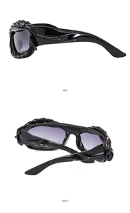 Detailed side and back view of Y2K wavy irregular black sunglasses with gradient lenses