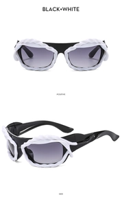 Detail of Y2K irregular sunglasses featuring black frames and white rope relief decor