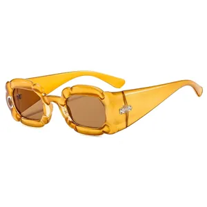 Modern irregular wave frame sunglasses with amber gradient and petal-shaped design