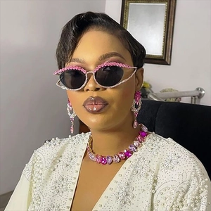 Pink rhinestone cat eye sunglasses with matching statement necklace and drop earrings