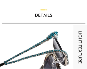 Detailed close-up of cat-eye sunglasses with blue rhinestones on a metal frame