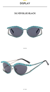 Detail views of luxury cat eye sunglasses with silver metal frames and blue rhinestones