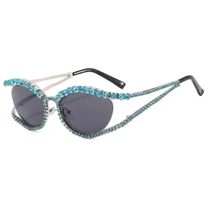 Luxury rhinestone cat-eye sunglasses with turquoise crystals and dark gray lenses