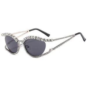 Luxurious cat eye sunglasses with gold metal frame and sparkling crystal rhinestones