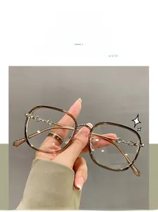 Detail view of stylish brown TR90 large frame glasses with decorative gold chain temples