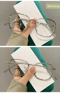 Close-up of cold grey TR90 square glasses frames with stylish metal buckle on the temple