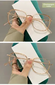 Detail of champagne TR90 glasses frame with hollow round metal temple design