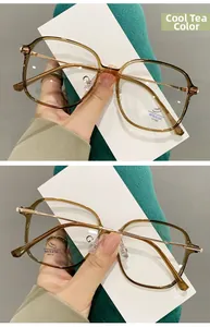 Detail view of tea-colored TR90 square glasses showing anti-blue light lens and metal temples