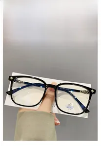 Close-up of TR90 anti-blue light glasses featuring silver cross motif on the temple