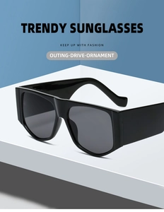 Macro shot of trendy black oversized sunglasses on a minimalist geometric stand