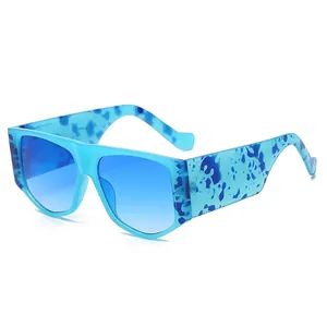 Fashionable oversized square sunglasses with blue spotted frame and gradient blue lenses