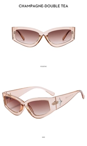 Dettagli degli occhiali da sole cat-eye champagne con accenti metallici a stella