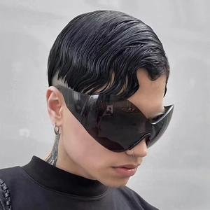 Futuristic Y2K wrap around oversized shield sunglasses with a sleek black rimless design