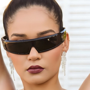 Futuristic Y2K wrap-around sunglasses with sparkling silver tassel rhinestone earrings