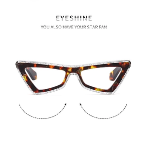 Detail of cat-eye eyewear frame with tortoiseshell texture and glittery finish