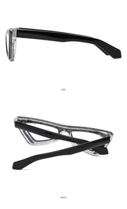 Detail view of cat-eye frames with silver glitter and thick black side temples