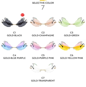 Detail view of butterfly shaped rimless sunglasses in 7 gradient colors with rhinestones