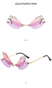 Macro detail of rimless dragonfly sunglasses with purple gradient lenses and rhinestones