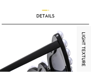 Close-up of black sunglasses frame decorated with elegant white pearls on the outer edges