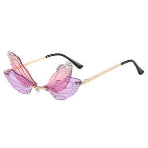 Frameless butterfly wing sunglasses with gradient purple lenses and crystal rhinestones